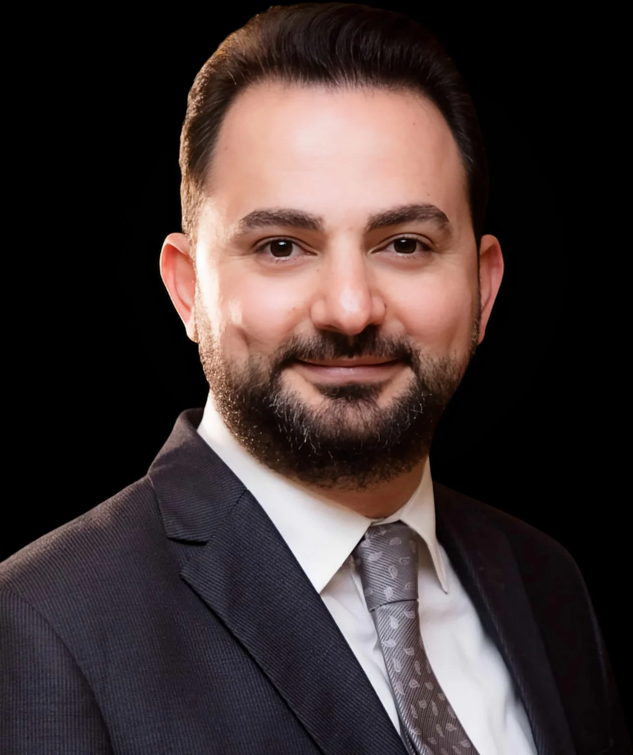 Dr. Majd Hermez, founder of Carne Media Training Center, portrait in cinematic low light